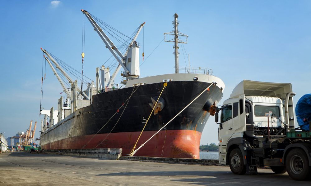 Commercial Ship or vessel at international harbor for logistics transportation